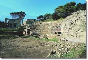 archaelogical excavation of the amphitheatre encircled by trees