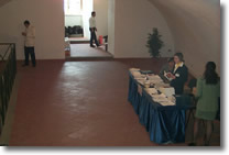 picture of the hall with hostess waiting for participants
